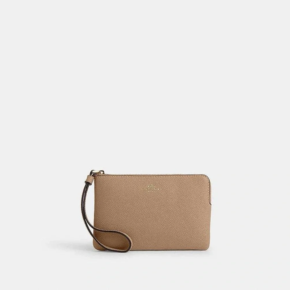 Coach Pebbled Leather Wristlet in Tan
